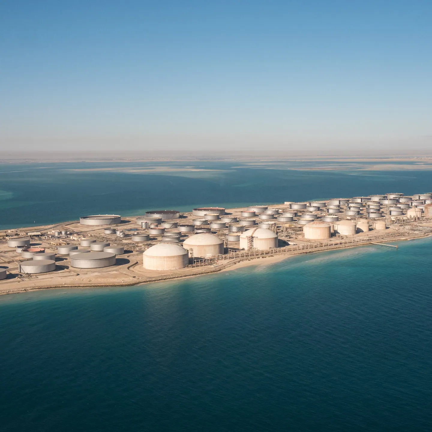 A coastal oil storage terminal extending along the shoreline